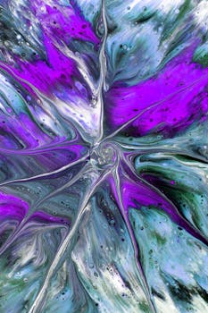Vibrant abstract fluid art design in purple hues with swirling patterns, evoking a sense of movement.