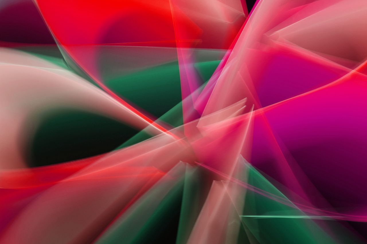 dynamic abstract image with vibrant red and green light patterns creat
