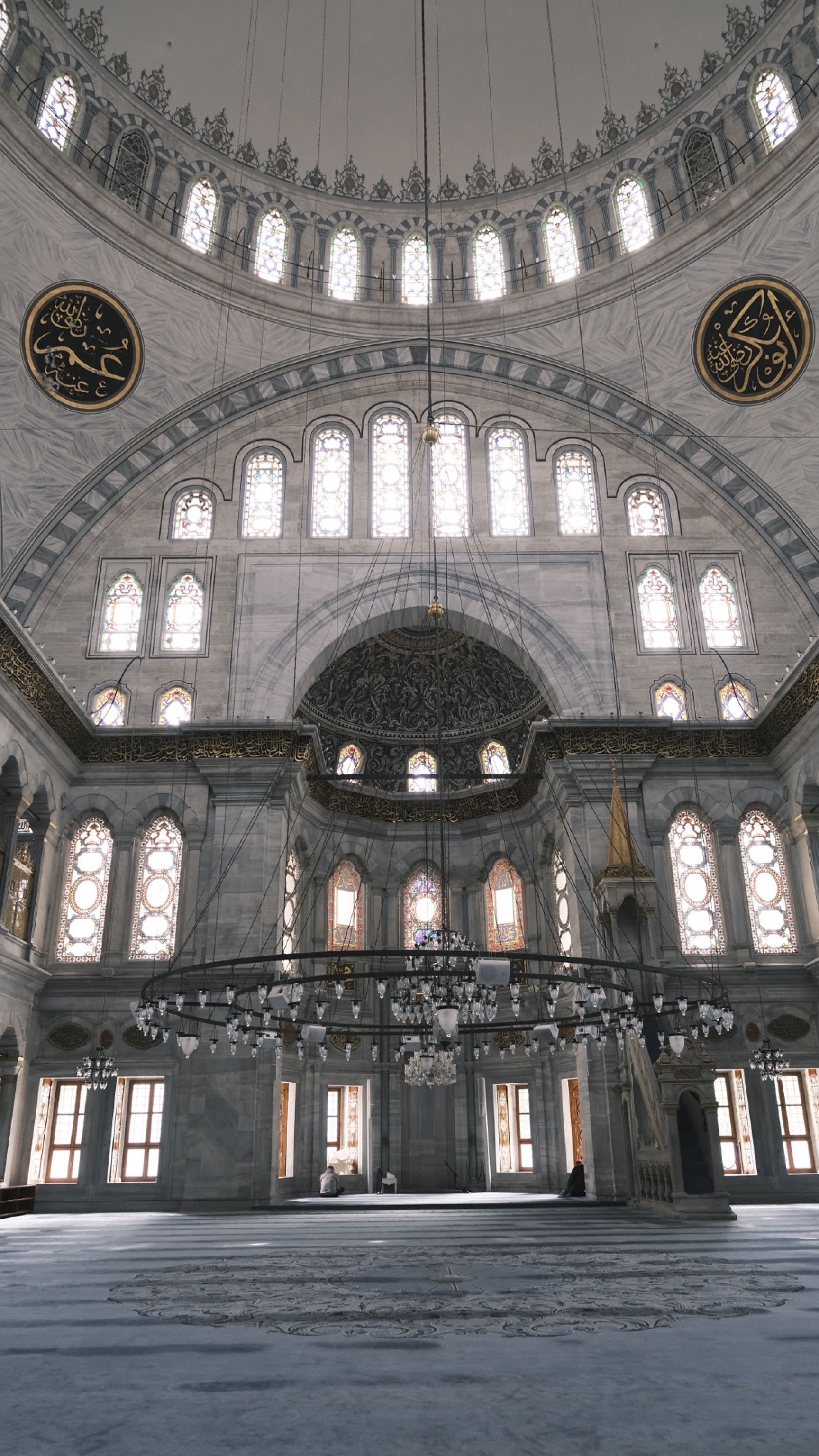 Explore the breathtaking interior architecture of a historical mosque in Istanbul, showcasing intricate dome and window designs.