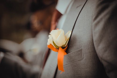 Flower inside man's suit jacket