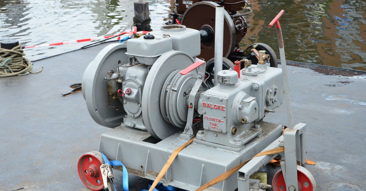 Industrial machinery on a dock platform near water, showcasing engineering and utility.