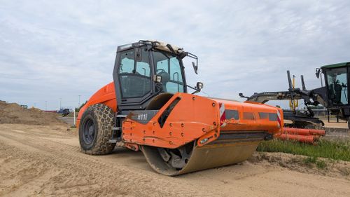 Free Road roller used in construction site at Werlte, Niedersachsen, Germany during daytime. Stock Photo