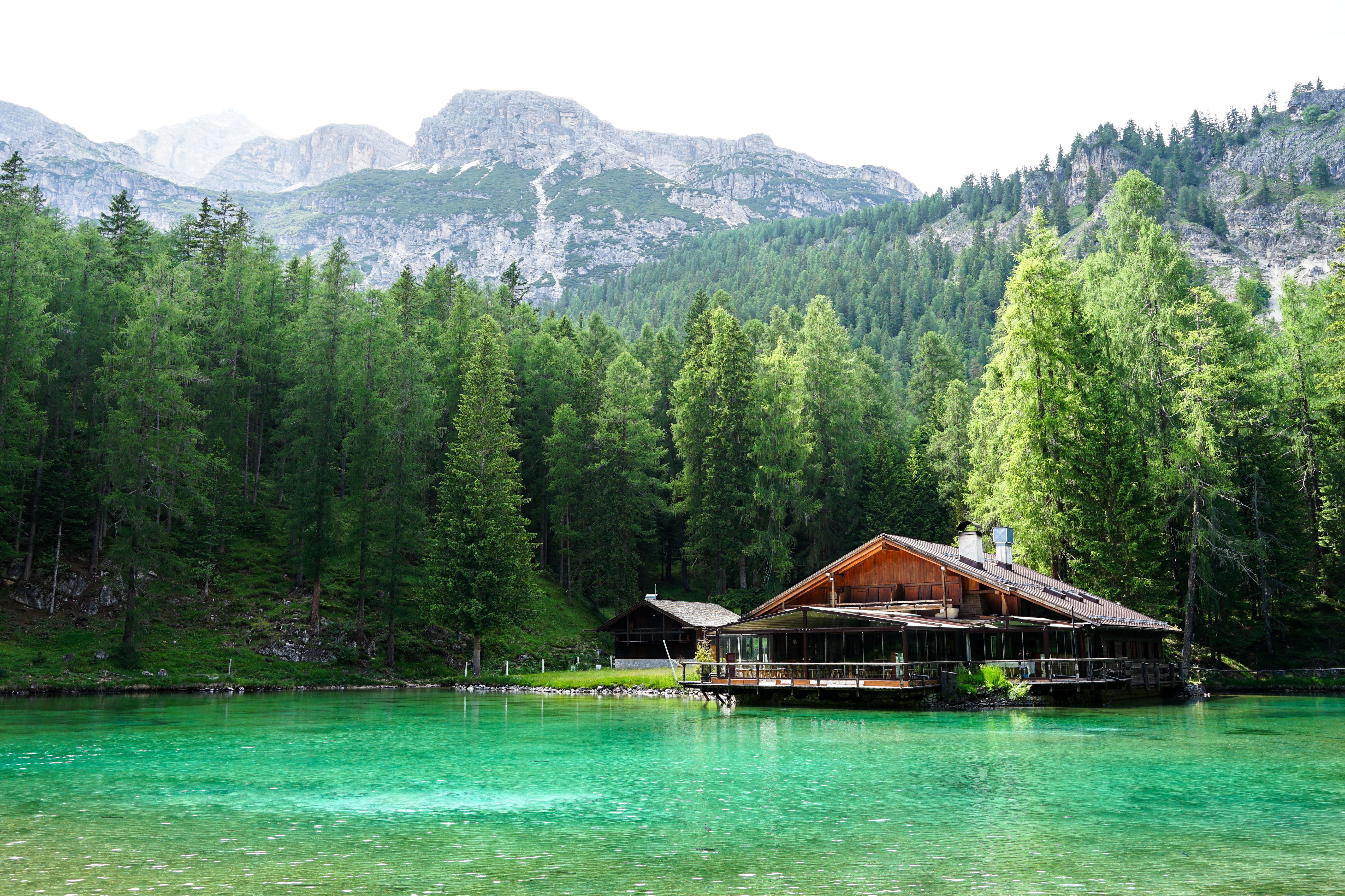 Scenic Mountain Lake with Rustic Cabin View · Free Stock Photo