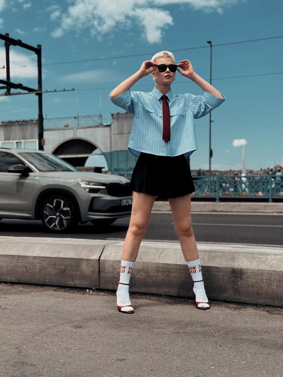 Fashionable Woman Posing on Urban Bridge · Free Stock Photo