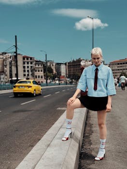 Stylish young adult posing in İstanbul's bustling streets, showcasing modern urban fashion style.
