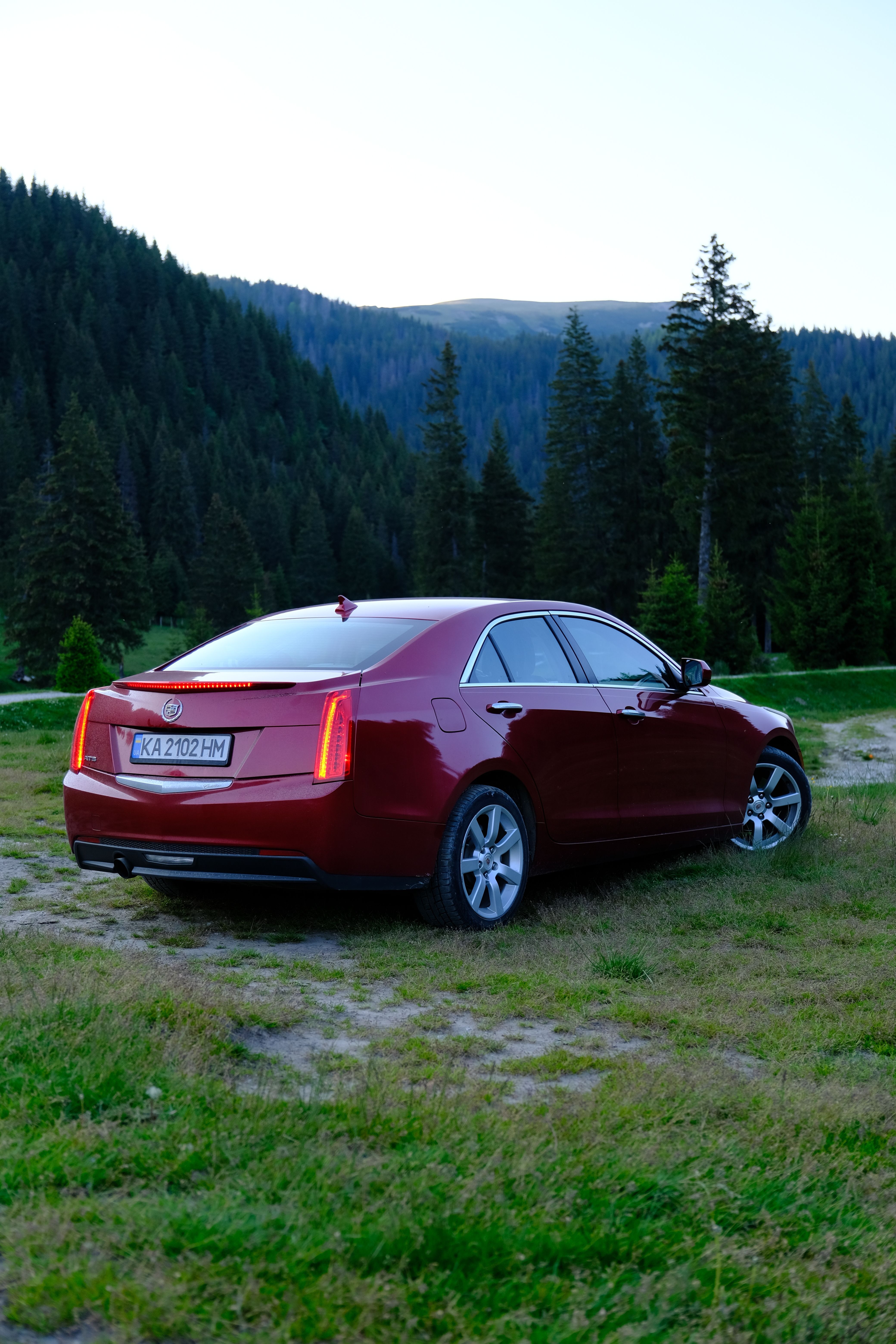 Red Car Parked in Scenic Mountain Landscape · Free Stock Photo