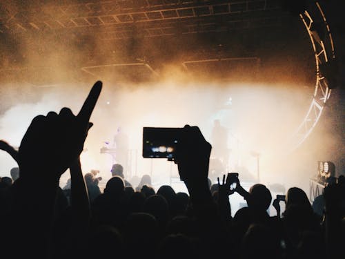 Free Silhouette People Photographing at Music Concert Stock Photo