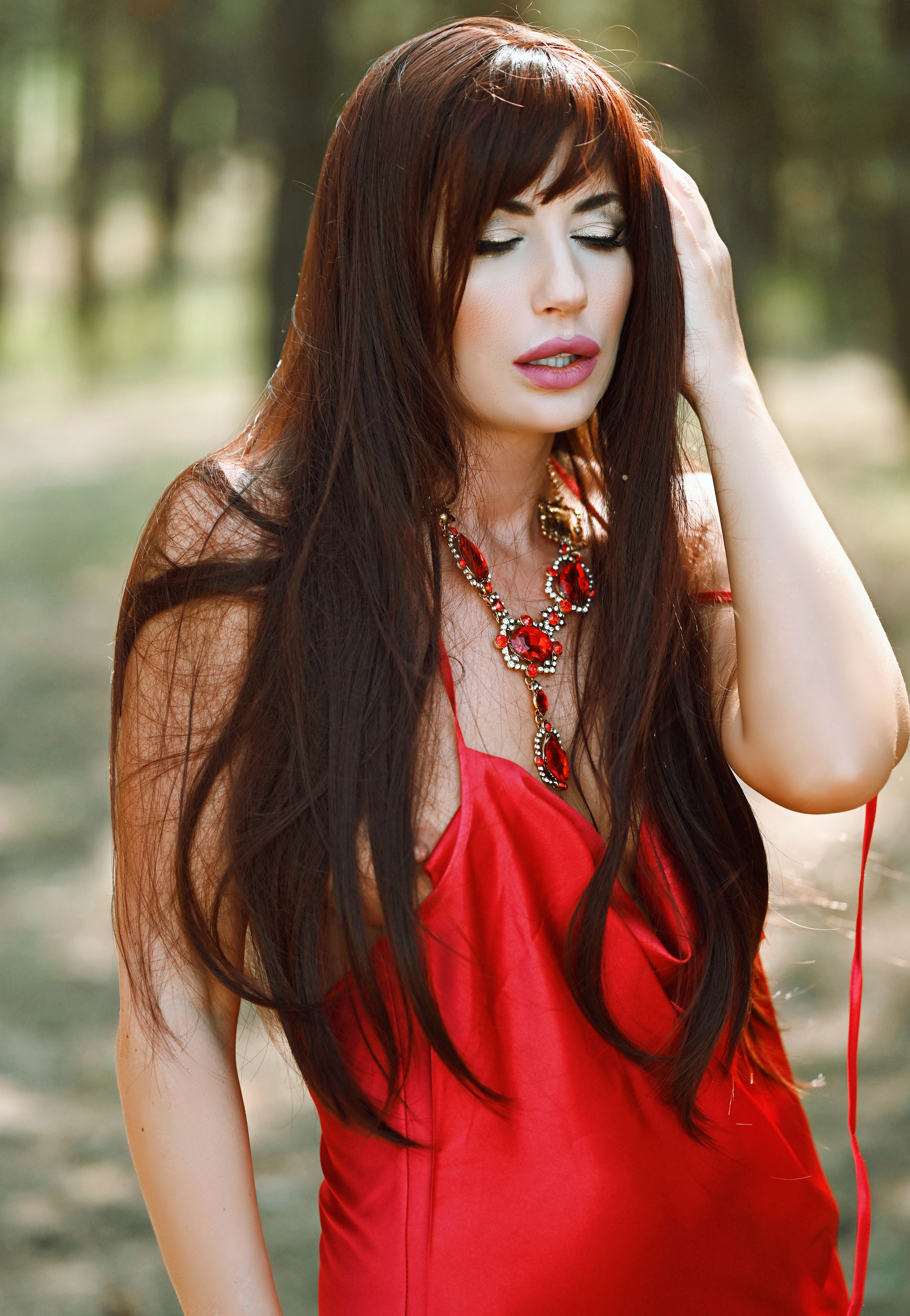 Elegant Woman in Red Dress Outdoors · Free Stock Photo