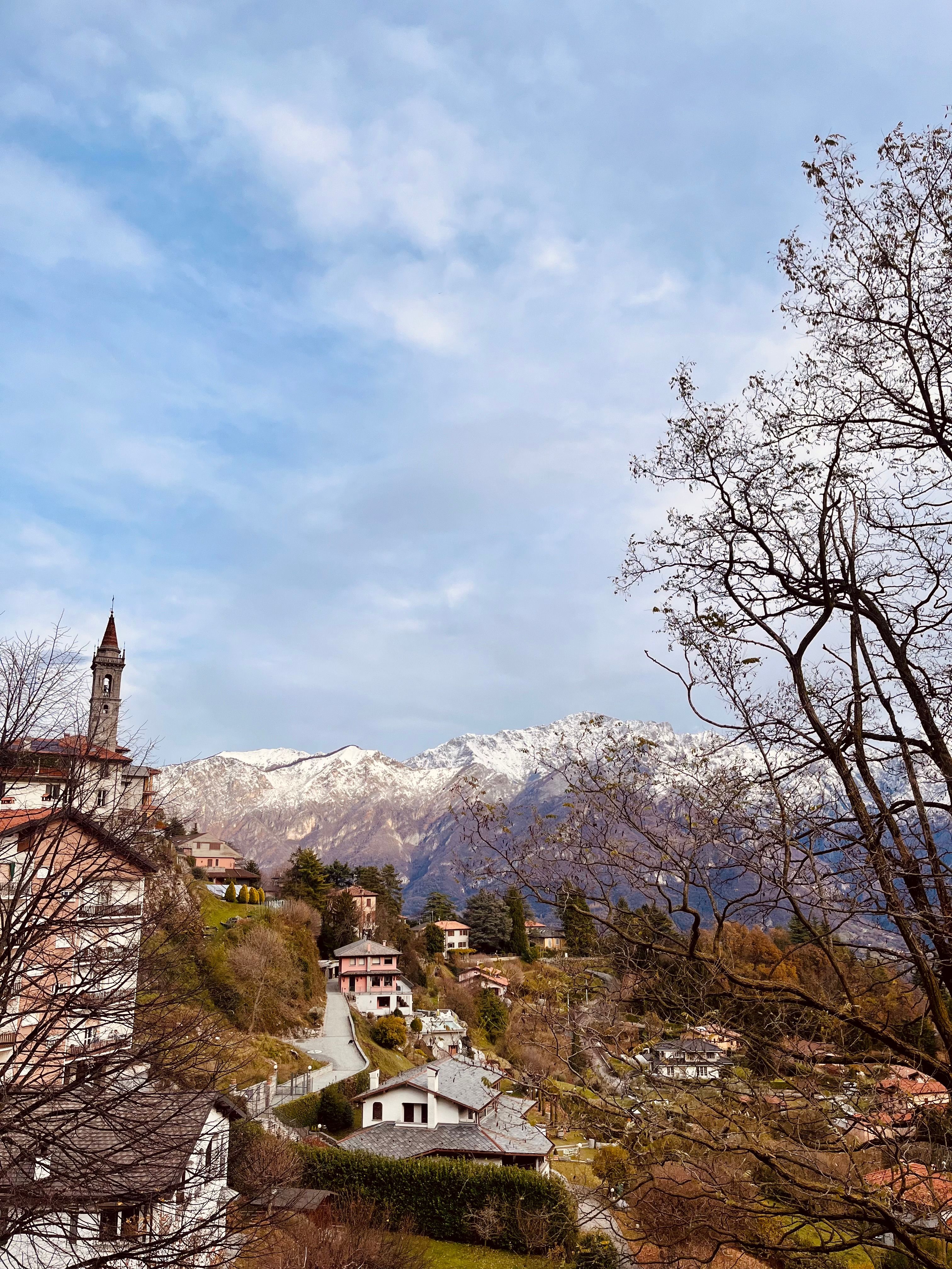 Scenic Italian Village with Snow-Capped Mountains · Free Stock Photo