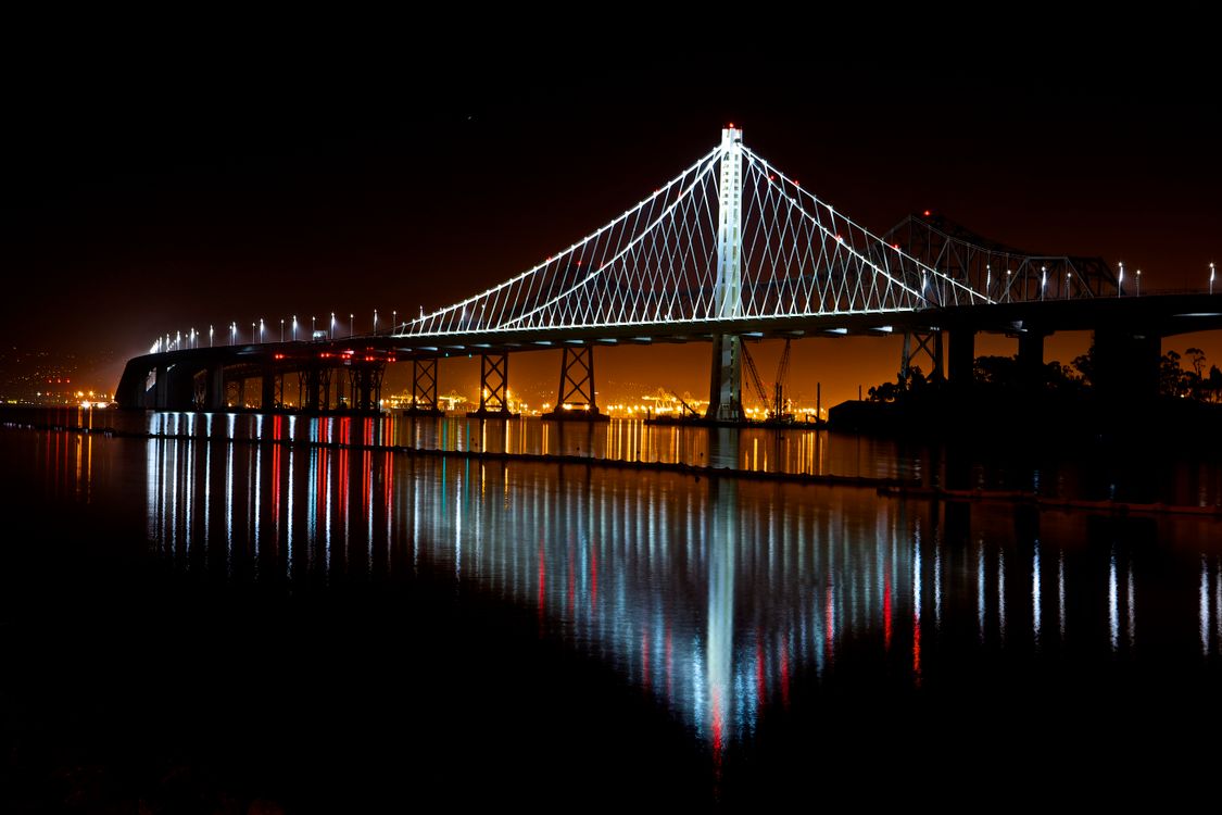 Illuminated Suspension Bridge Against Sky at Night · Free Stock Photo
