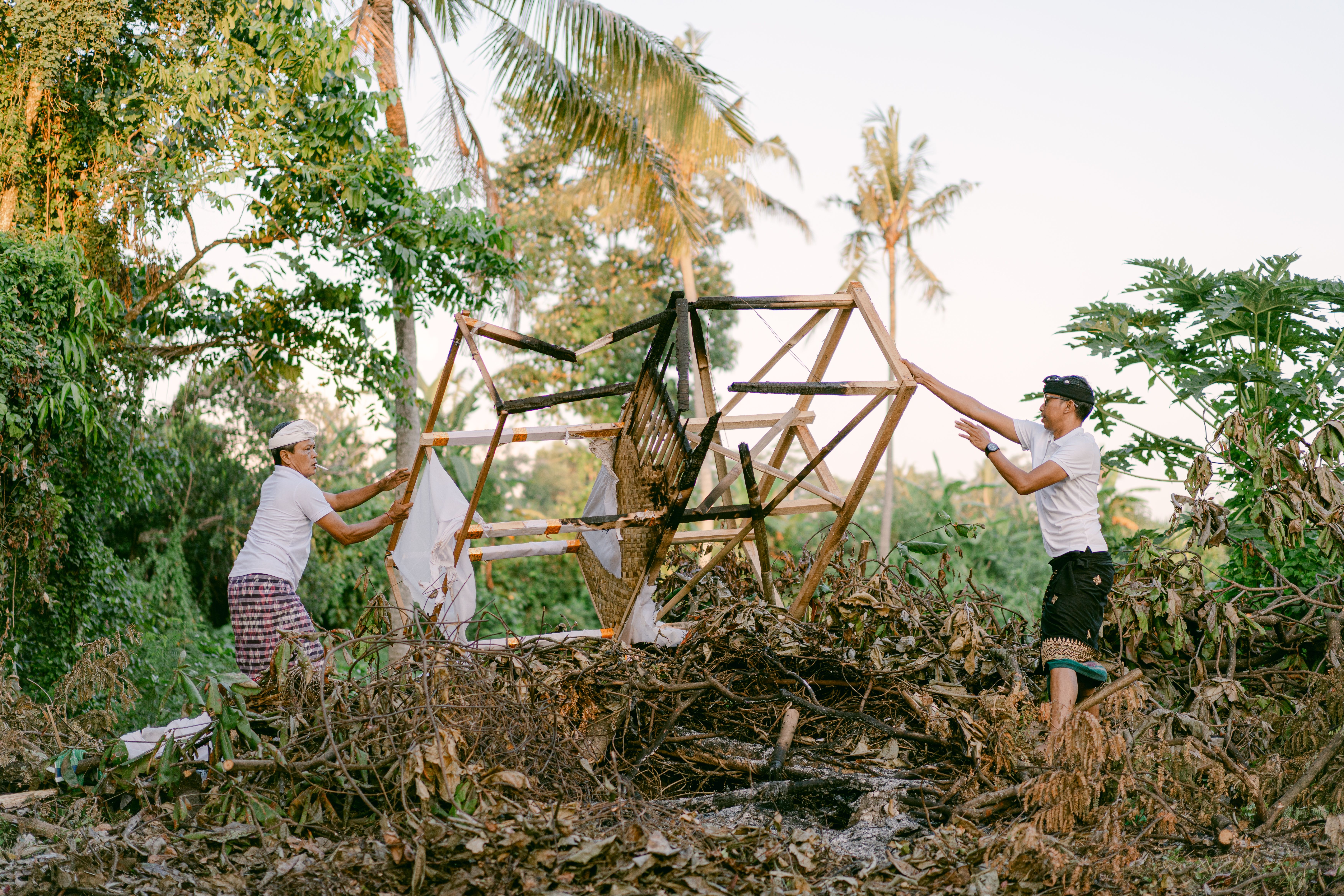 People Building Wooden Structure Outdoors · Free Stock Photo