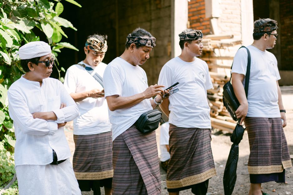 Traveler wearing a sarong and sash at Prambanan Temple in Indonesia