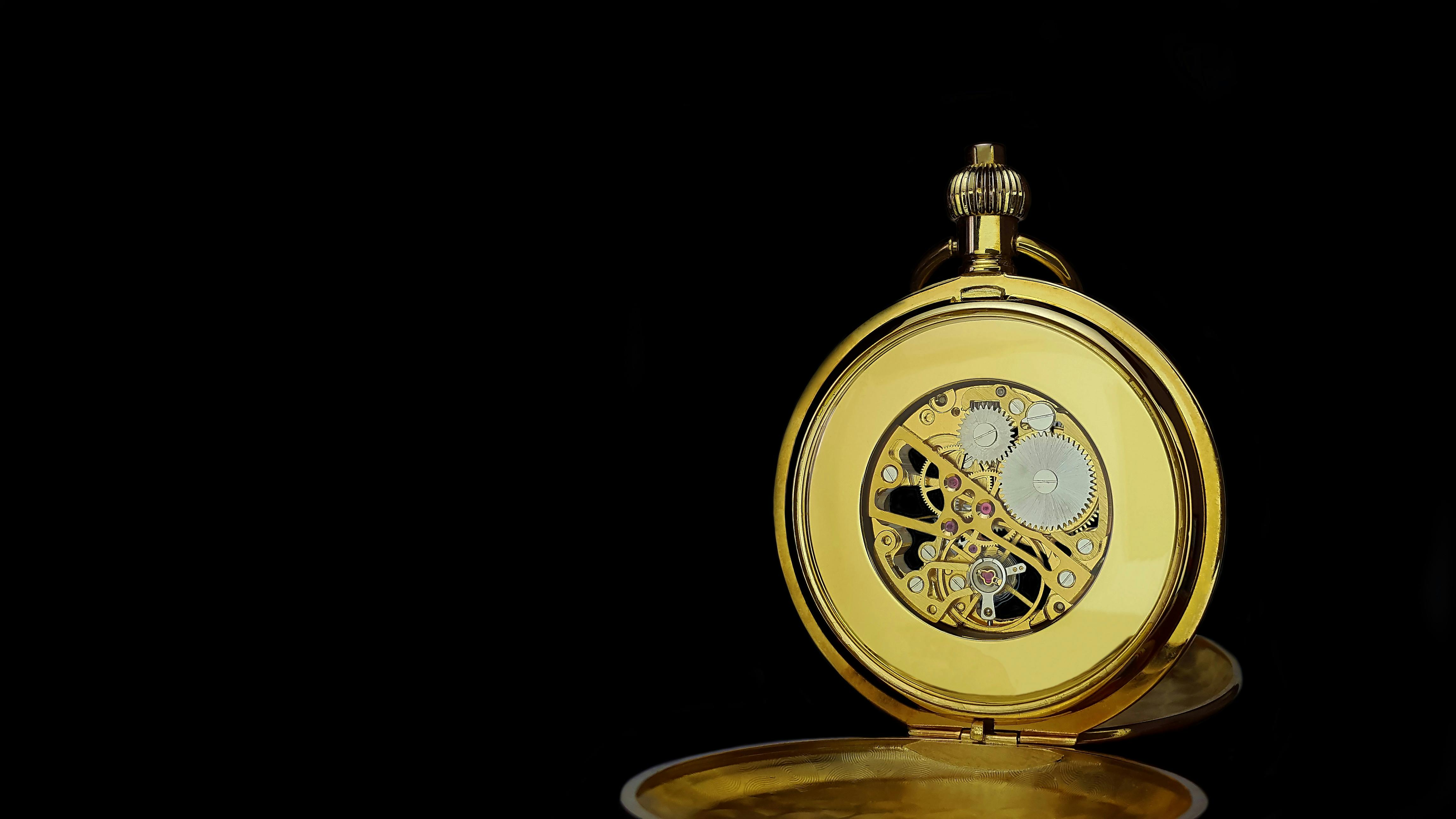 Closeup of Pocket Watch Gears Against Black Background · Free Stock Photo