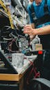 Technician Repairing Printer in Workshop