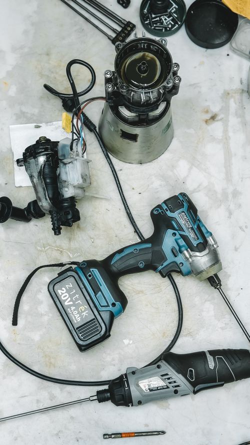 Disassembled appliance parts during a mechanical repair