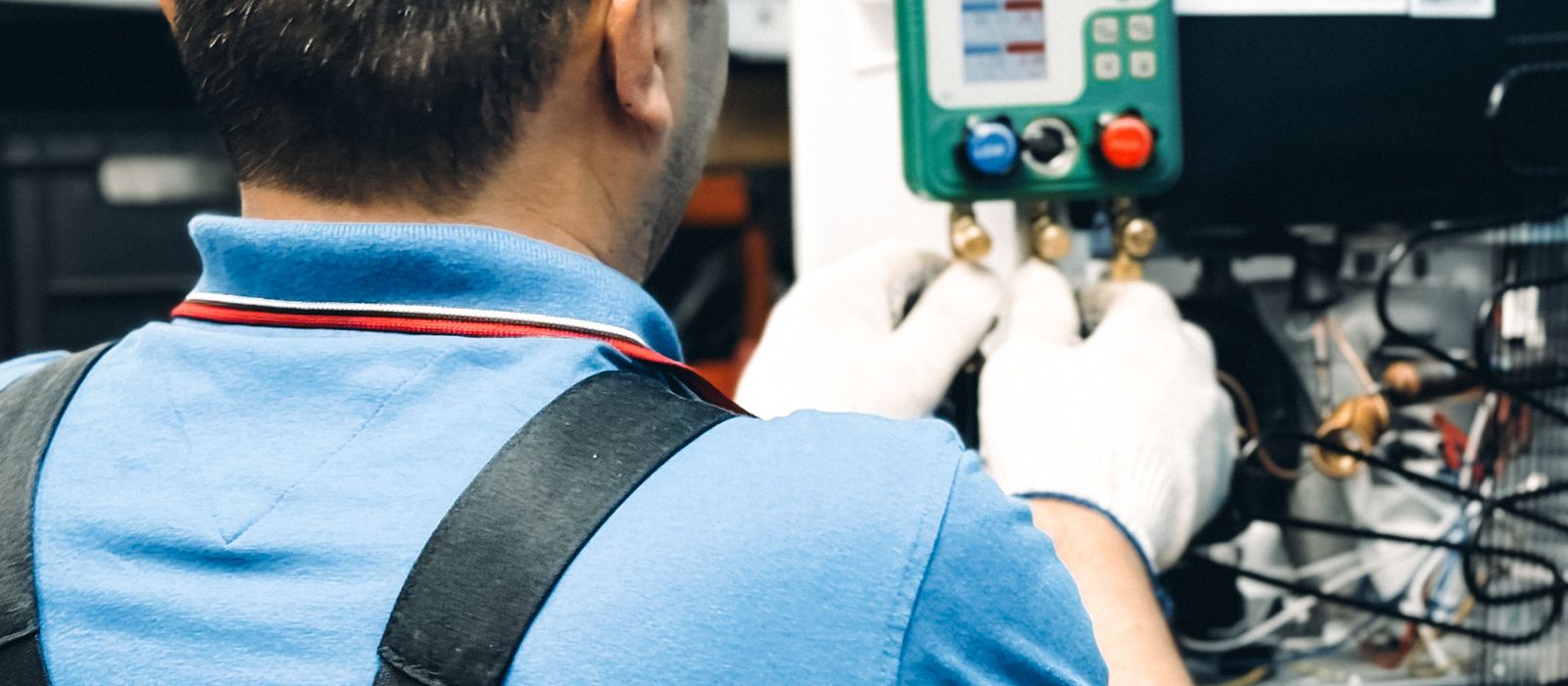Technician working on an HVAC system indoors