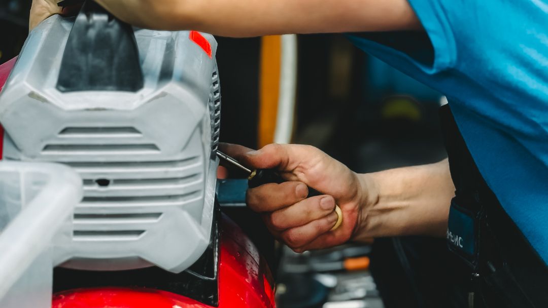 A technician servicing a compressor unit