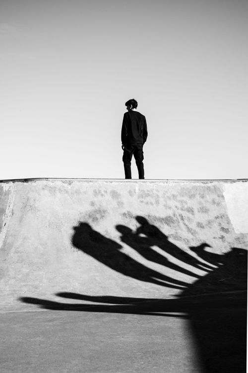 Free Black and white photo of a skateboarder casting shadows in a Buenos Aires skate park. Stock Photo