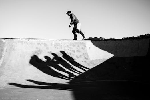 Black and white silhouette of a skateboarder at a skate park in Buenos Aires.