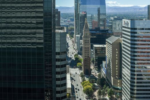A stunning aerial view of downtown Denver showcasing the iconic clock tower amidst modern skyscrapers.