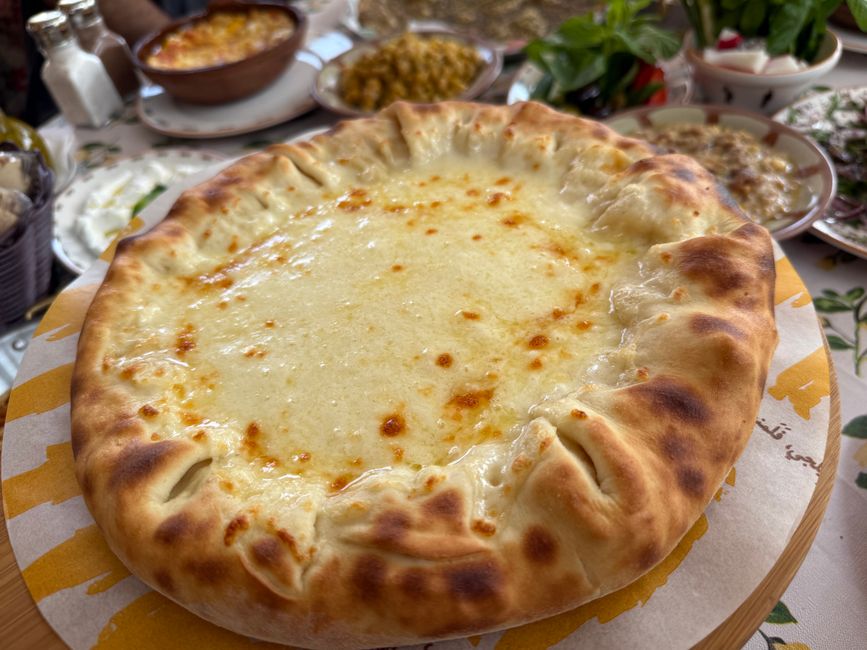 A traditional Mingrelian feast with khachapuri and local wine - economical Georgia Black Sea A traditional Mingrelian feast with khachapuri and local wine - economical Georgia Black Sea
