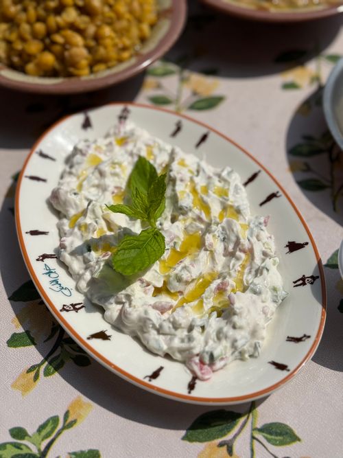 Free Delicious creamy tzatziki garnished with fresh mint and olive oil, perfect for a summer meal. Stock Photo