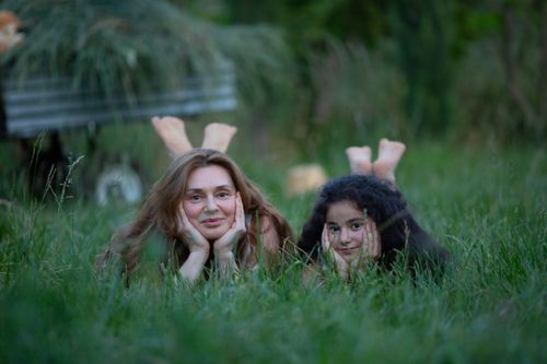 Free Heartwarming scene of a mother and daughter bonding in a lush park in Baku, Azerbaijan. Stock Photo