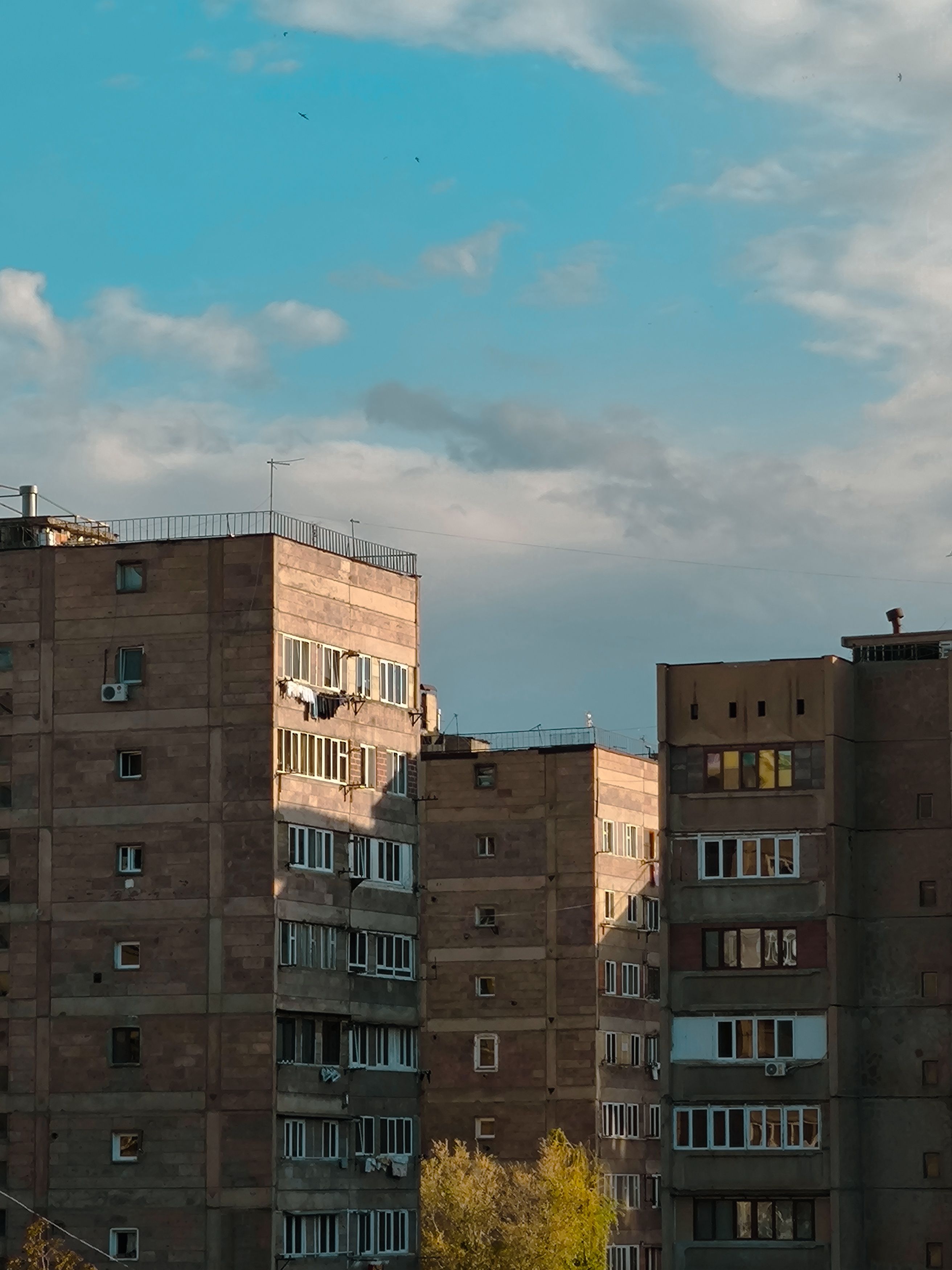 Urban Apartment Buildings under Blue Sky · Free Stock Photo