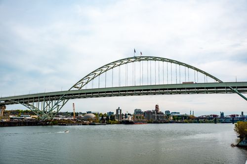 Free The iconic Fremont Bridge spans the Willamette River in Portland, Oregon, with the city skyline in the background. Stock Photo