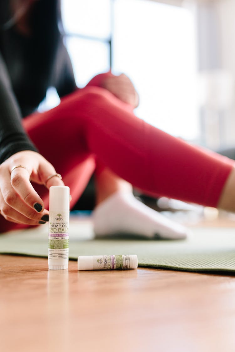Woman Reaching For CBD Product