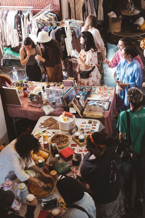 Free View of a vibrant indoor market in Rabat with diverse stands and visitors exploring unique handmade crafts and food. Stock Photo