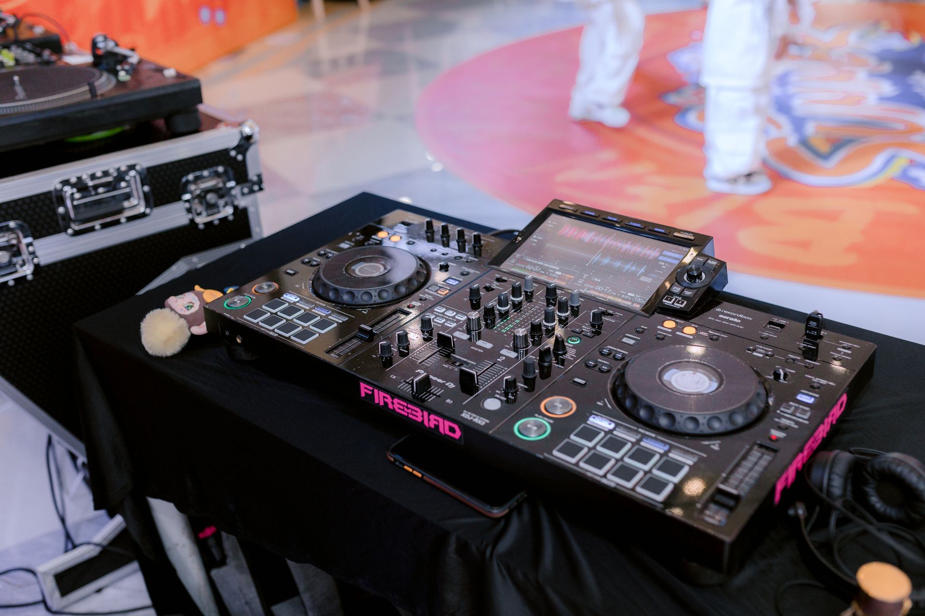 Wedding DJ Venue Questions That Prevent Setup Problems Close-up of a professional DJ mixer and turntable ready for an indoor event.