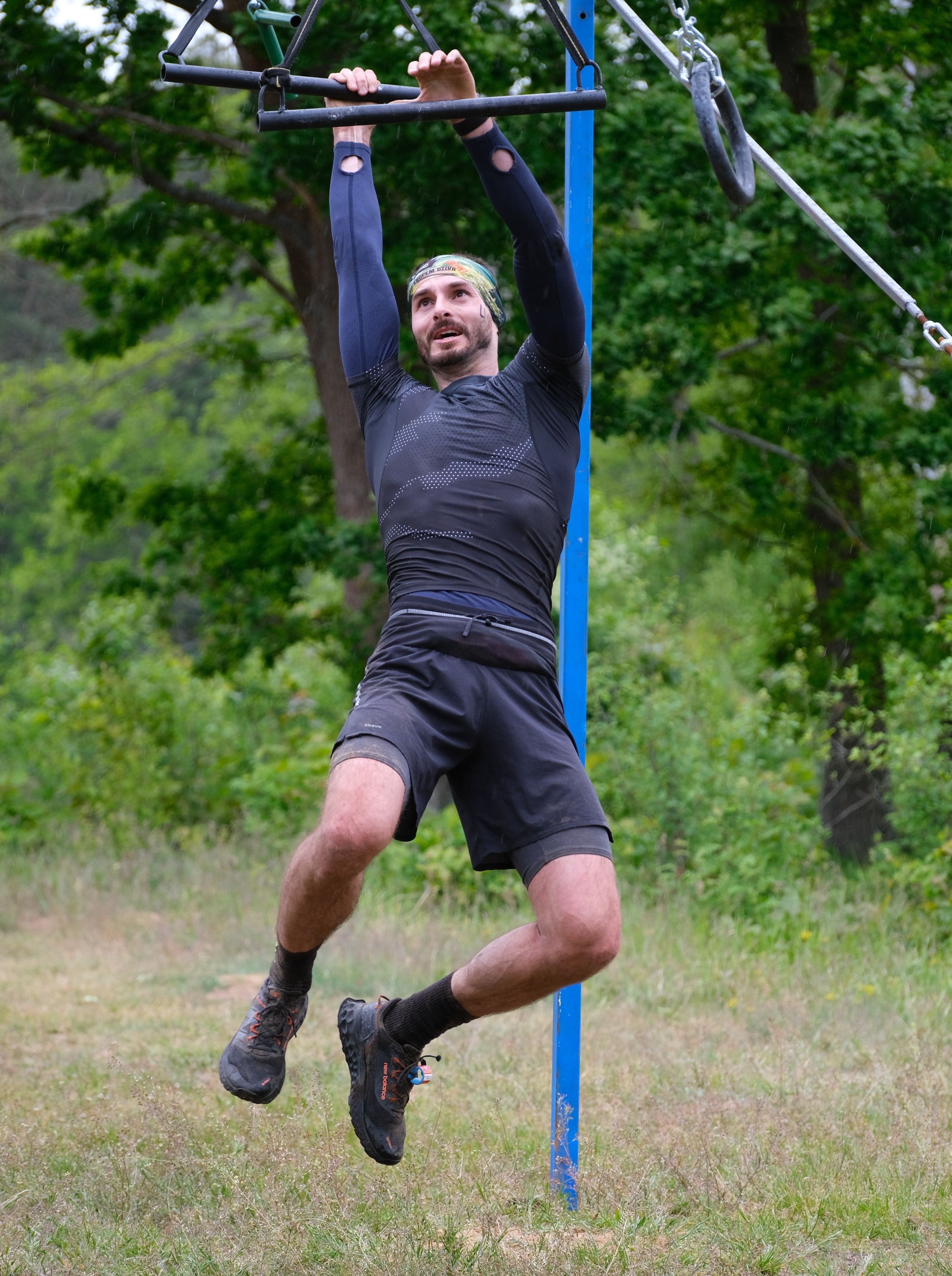 Man Performing Outdoor Obstacle Course Challenge · Free Stock Photo