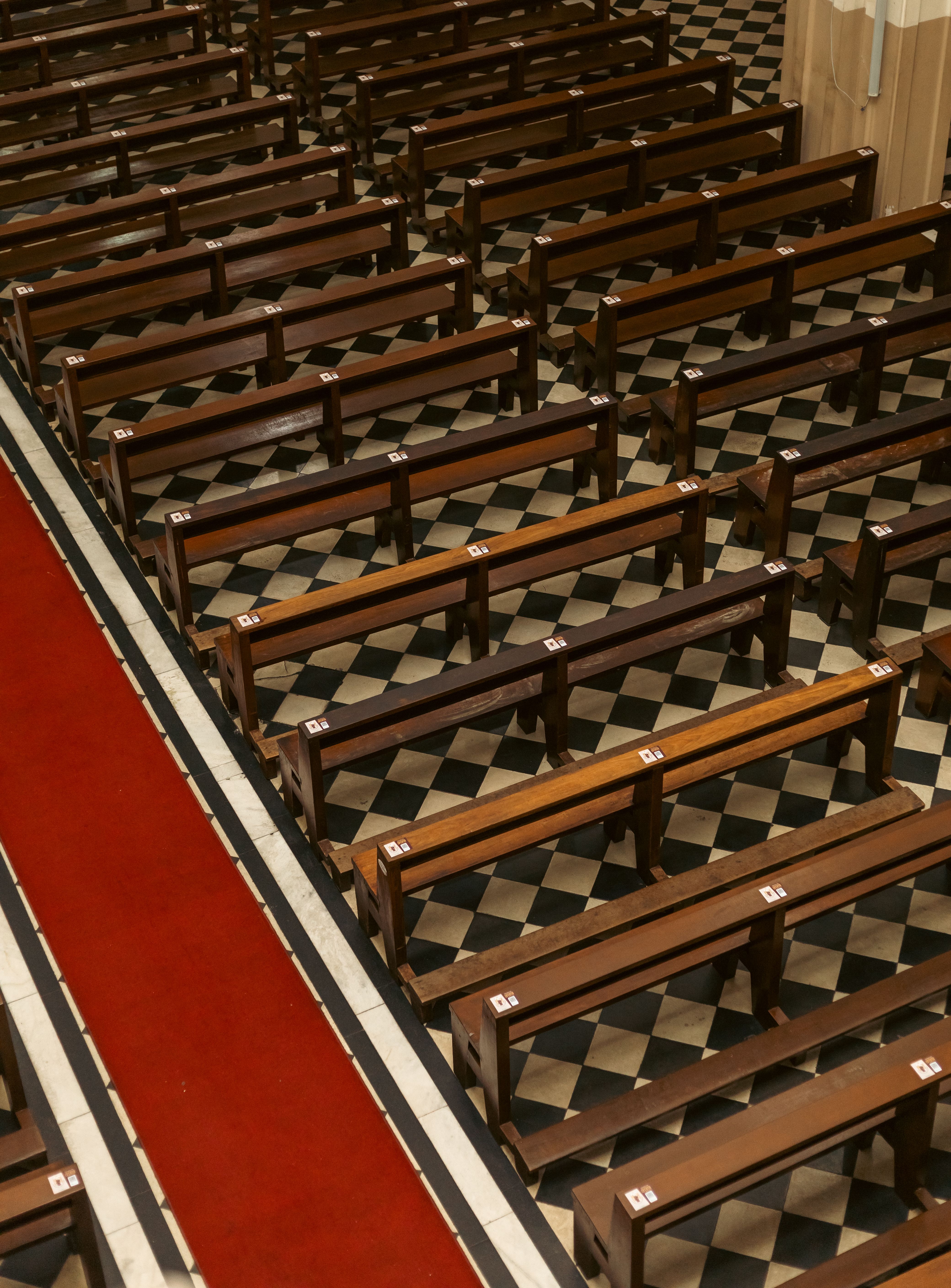 Empty Church Pews in Geometric Pattern · Free Stock Photo