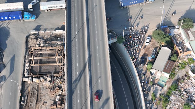 Drone shot of a busy road and construction site in Thu Duc, Ho Chi Minh City, Vietnam.