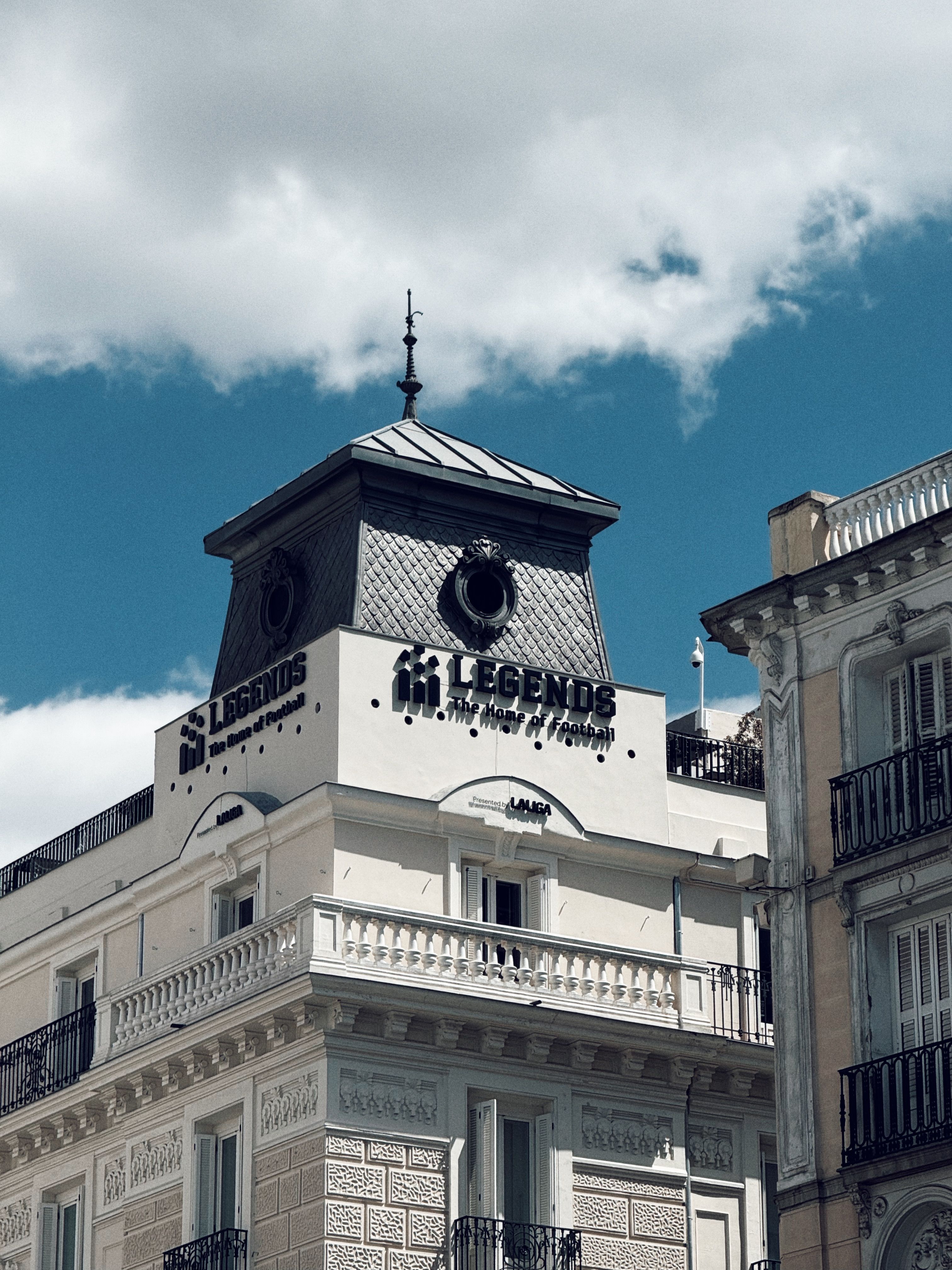 Historic European Building with Legends Sign