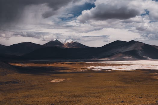 Stunning view of the Atacama Desert under dramatic clouds, showcasing expansive Chilean landscapes.