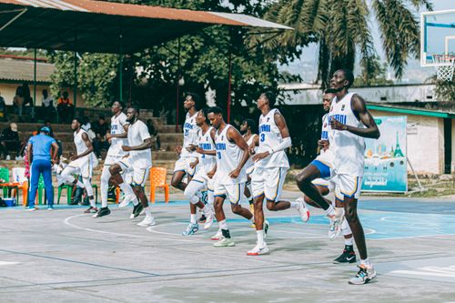 Free Group of young athletes practicing on an outdoor basketball court in summer. Stock Photo