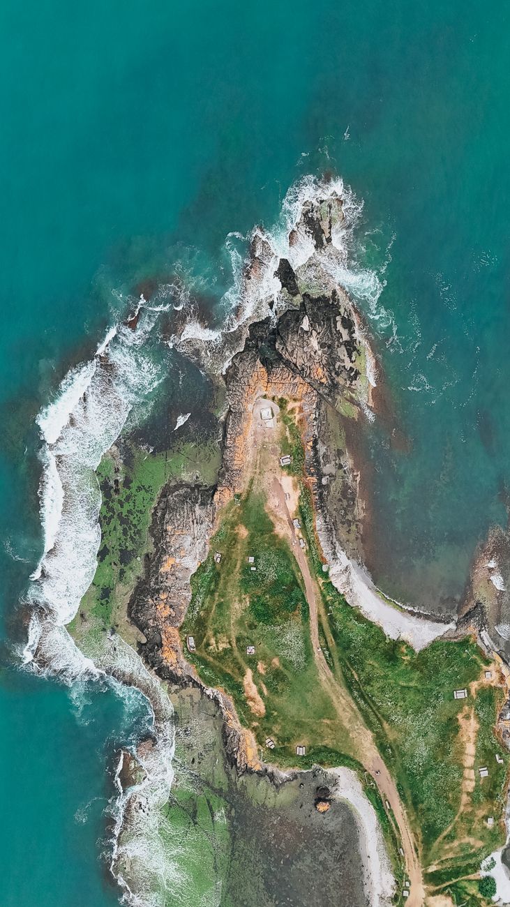 Stunning aerial shot of a rocky coastline with turquoise waters near Sinop, Turkey.