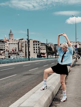 Dynamic urban fashion portrait on Istanbul street with iconic Galata Tower view and trendy style.
