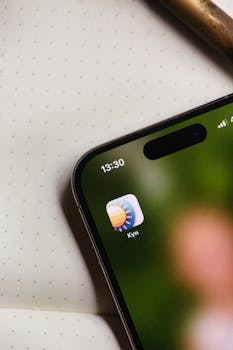 Close-up of a smartphone screen displaying a weather app icon. Ideal for tech-related themes.