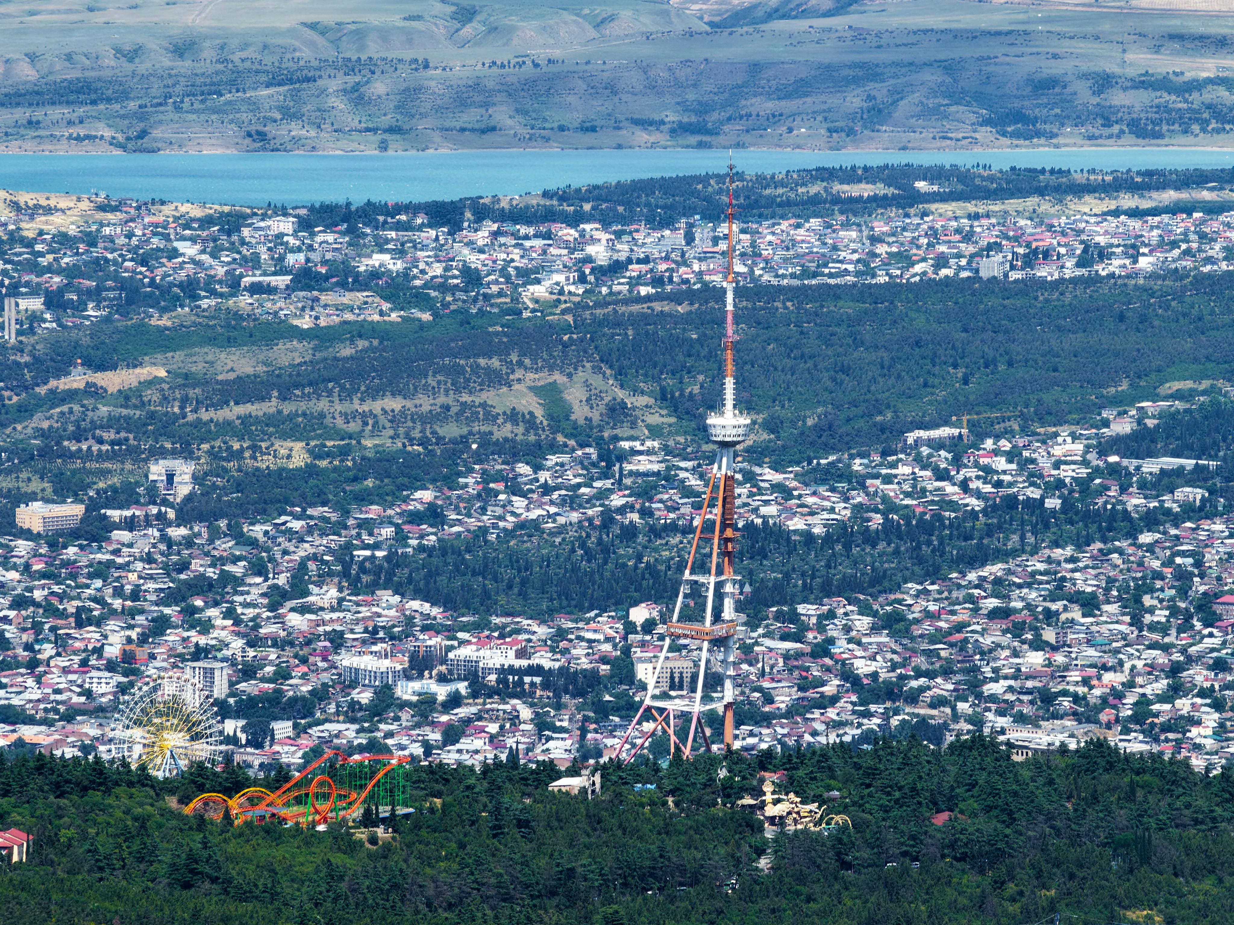 A stunning aerial view of Tbilisi showcasing the iconic TV Tower and sprawling cityscape.
