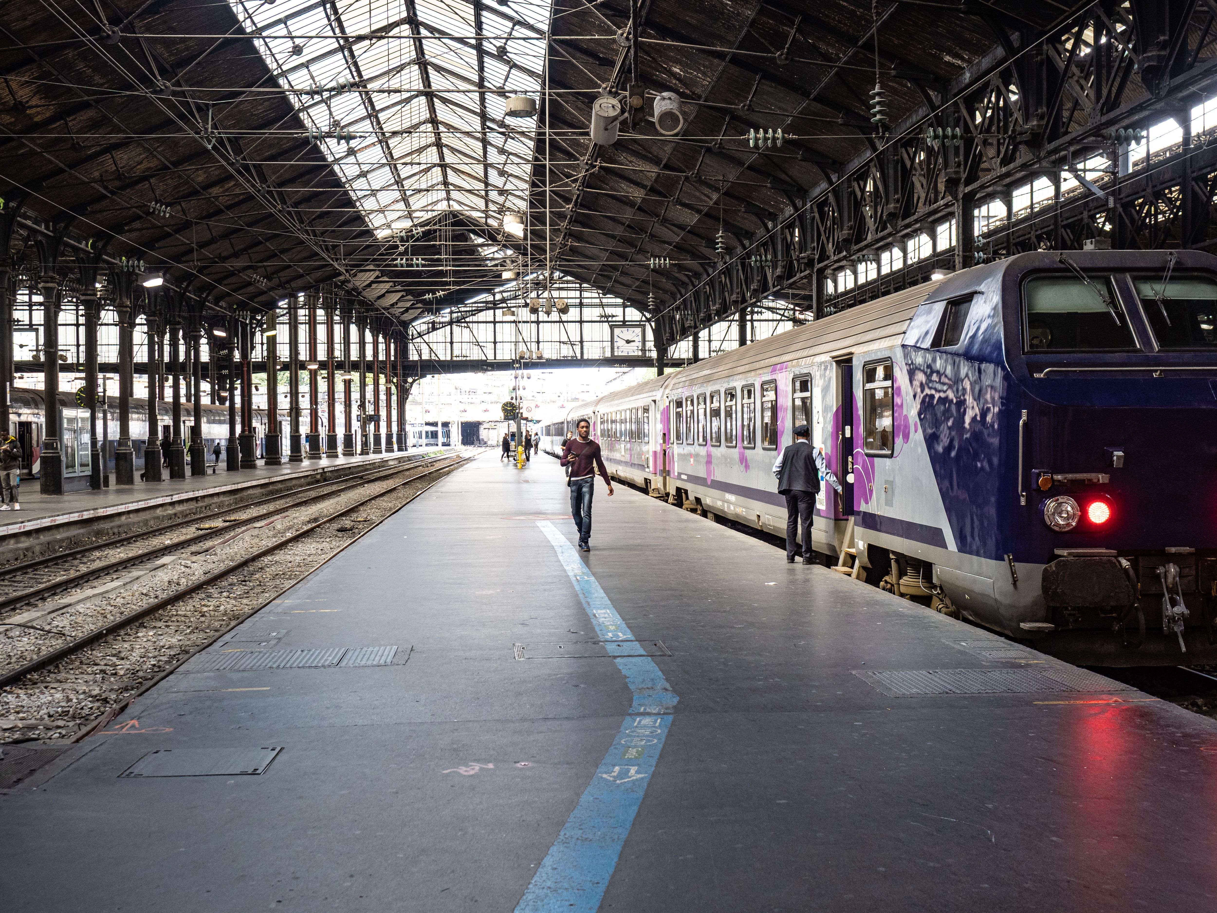 Modern high-speed TGV train at a busy Paris train station