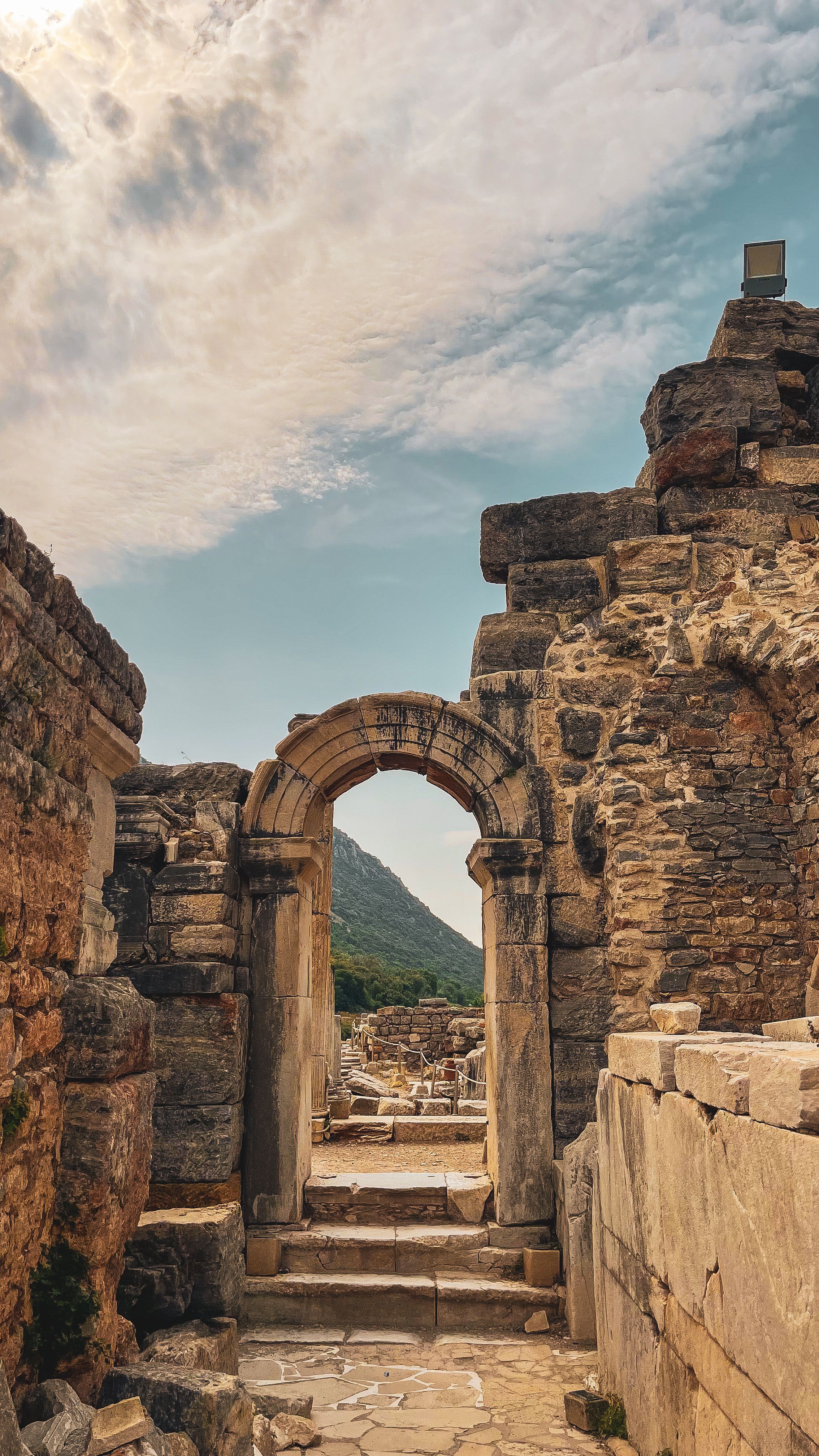 Ancient Ruins with Stone Archway under Blue Sky · Free Stock Photo