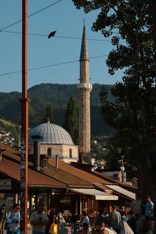 Free A beautiful view of a historic mosque with a tall minaret in Sarajevo during sunset. Stock Photo