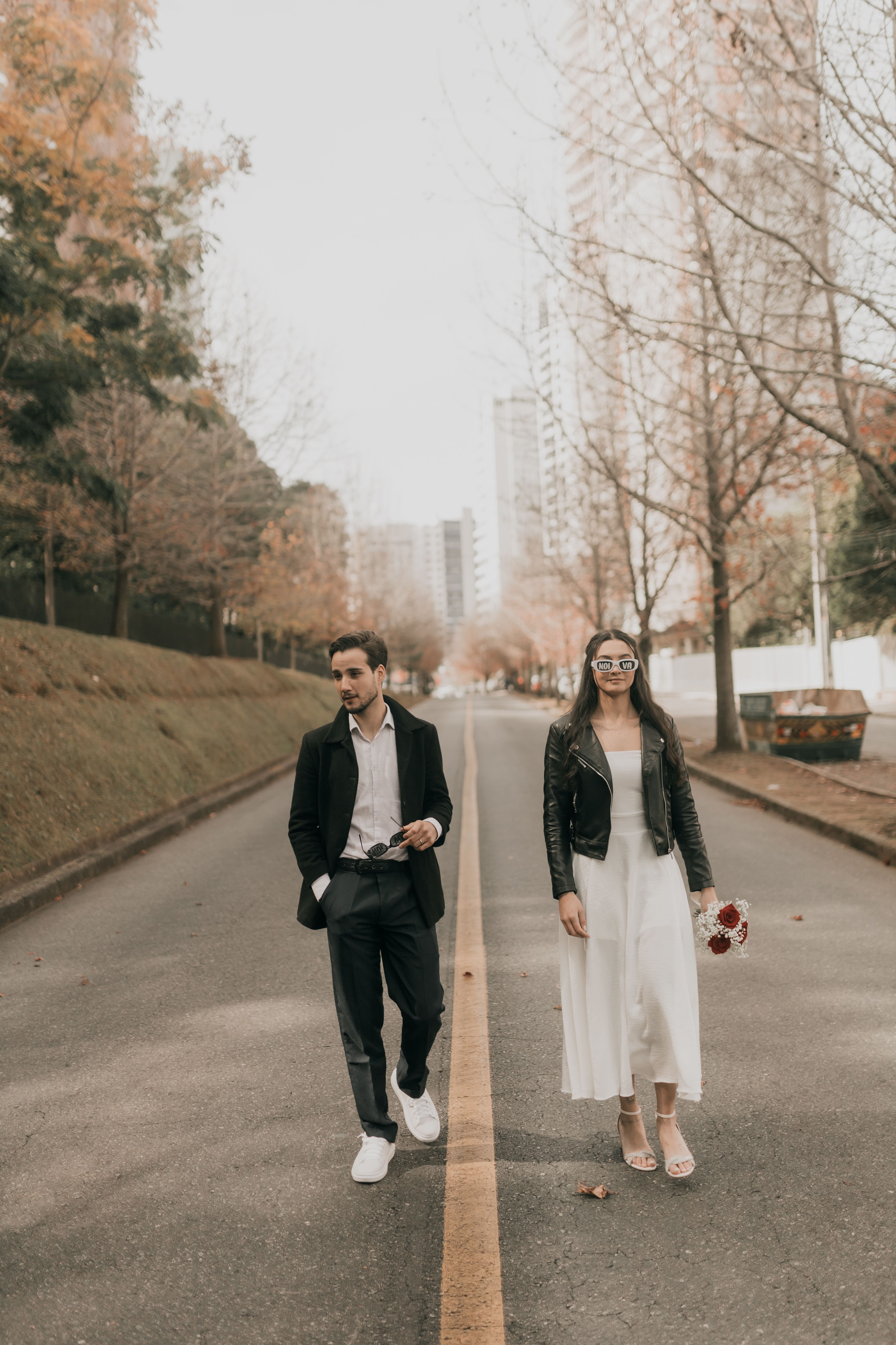 Stylish Couple Walking Down City Street in Fall · Free Stock Photo