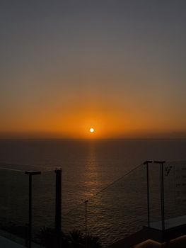 Captivating sunset over the ocean, viewed from a terrace in Spain.