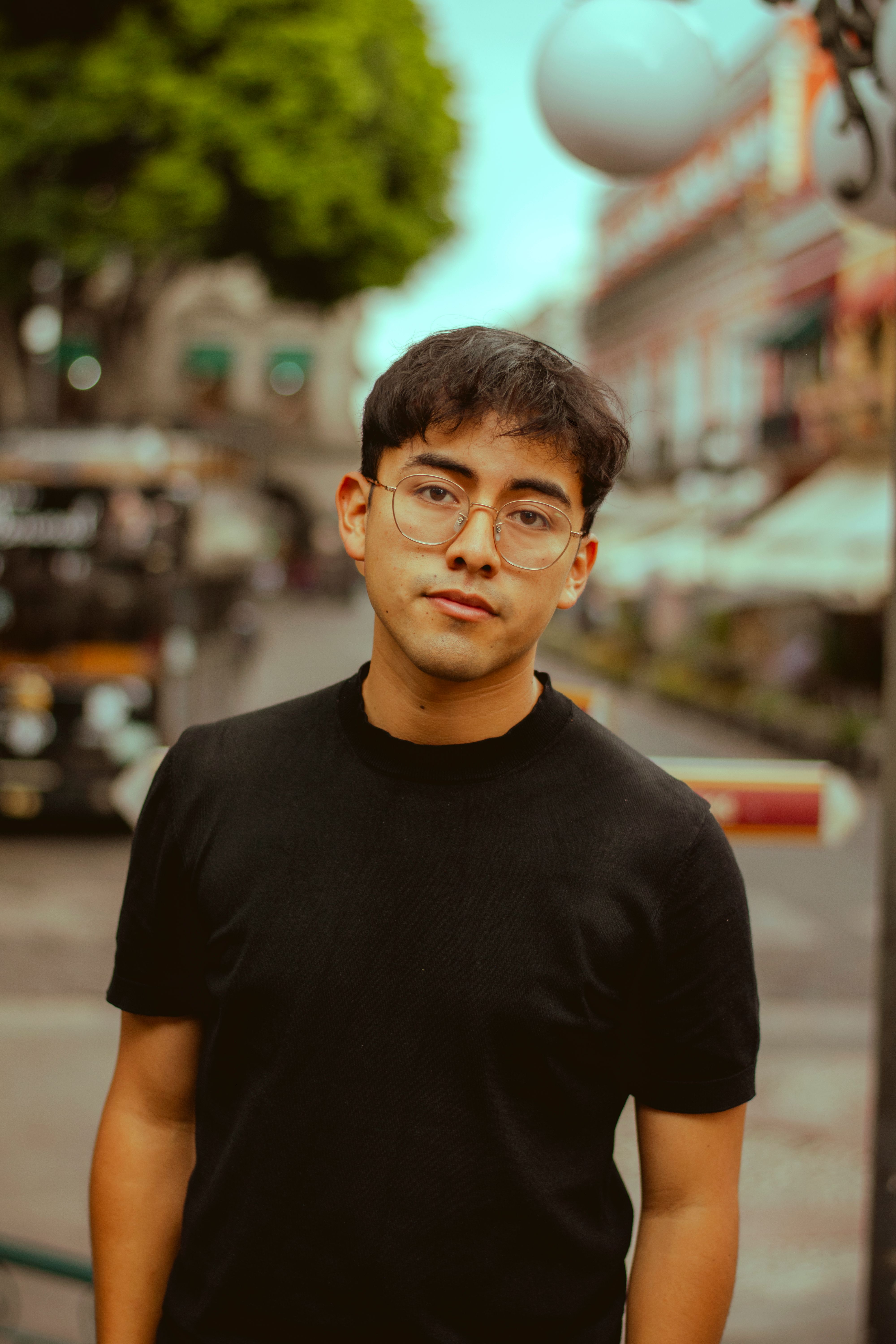 Young Man Posing on Urban Street in Soft Light · Free Stock Photo