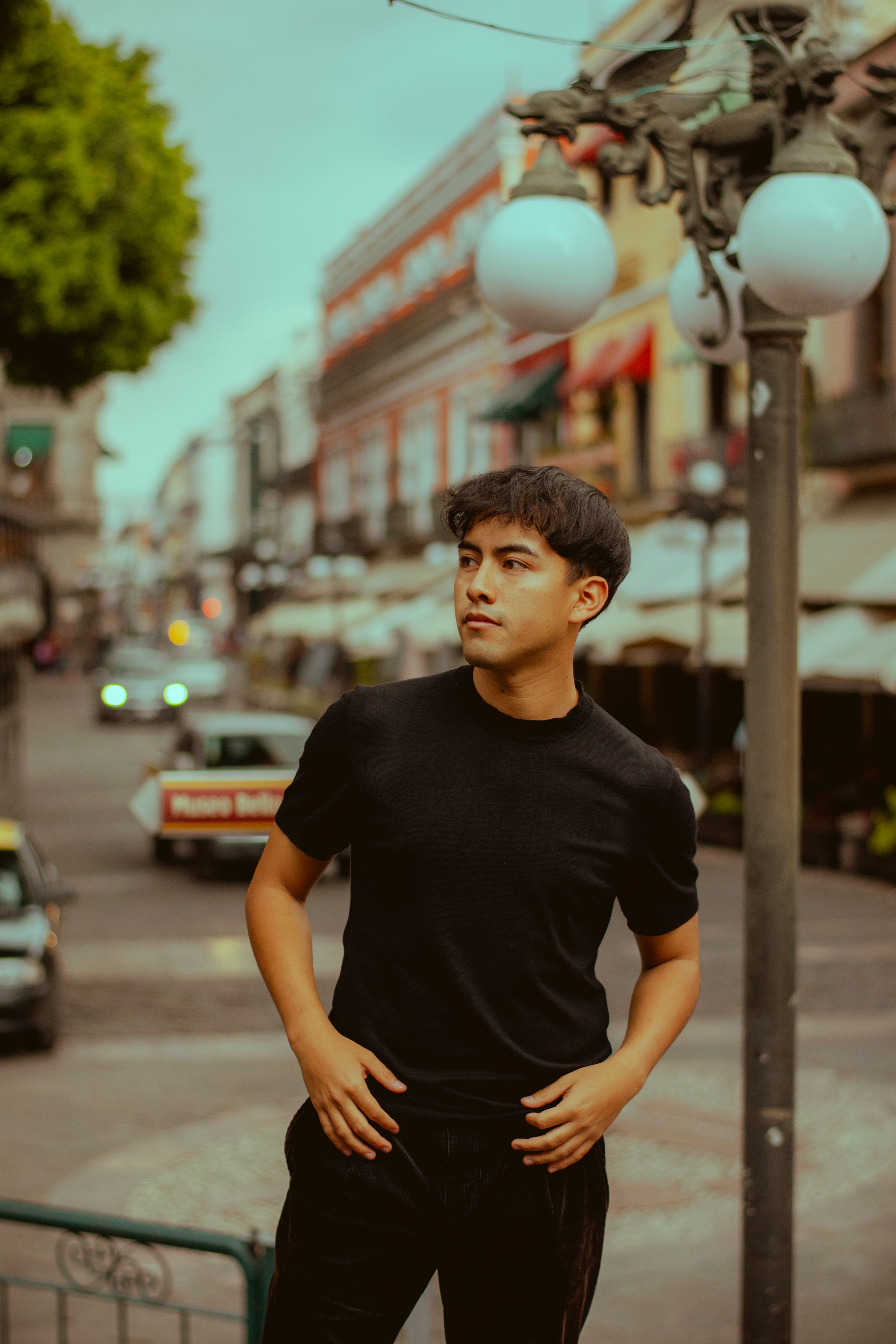 Stylish Young Man Posing in Urban Street Setting · Free Stock Photo