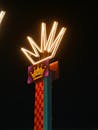 Illuminated Neon Crown Sign at Night